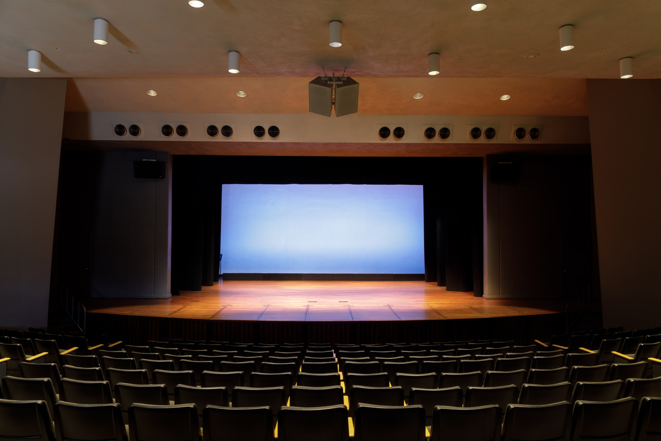 Empty Stage in an Auditorium with Scrim